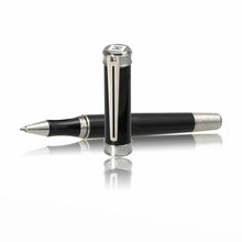 Load image into Gallery viewer, The rollerball pen laid flat on a white surface with the cap placed in front of it. The pen is black with gray trims.
