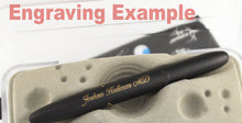 Load image into Gallery viewer, Close up to an engraved name on the pen with cursive: Joshua Kallman M.D.
