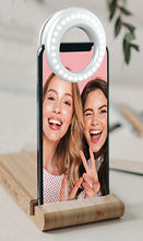 Load image into Gallery viewer, The selfie ring attached to a cellphone lighting two girls taking a picture.

