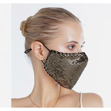 Load image into Gallery viewer, A young woman wearing the gold sequin face mask. 
