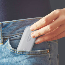 Load image into Gallery viewer, Close up to a hand pulling the Gray go-sip set from a jeans pocket.
