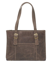 Load image into Gallery viewer, Back view of the brown leather bag with the shoulder straps pulled up. 
