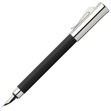Load image into Gallery viewer, Side view of the black Tamitio pen with the cap posted at the top.
