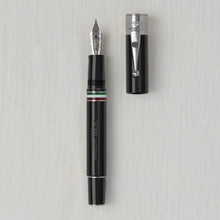Load image into Gallery viewer, Front view of the black and silver fountain pen with the cap next to it. 
