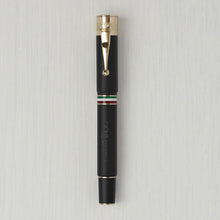 Load image into Gallery viewer, Front view of the matte black fountain pen with golden trims.
