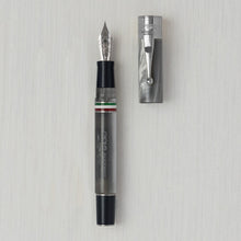 Load image into Gallery viewer, Front view of the Perla Fountain pen with silver trims. The cap is set next to it.
