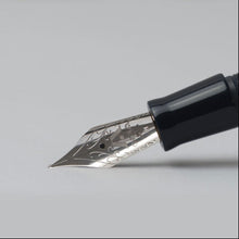 Load image into Gallery viewer, Close up to the fountain pen nib with engraved Gioia logo and decorations.
