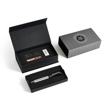 Load image into Gallery viewer, The black Lima pen arranged with the packaging and contents on a white background. 
