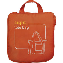 Load image into Gallery viewer, The orange tote bag folded into the compact zipper-closing pocket with a grab handle. 
