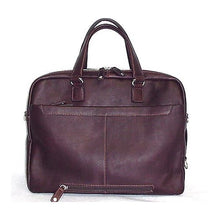 Load image into Gallery viewer, Back panel view of the brown suitcase, featuring two zipper-closing compartments.
