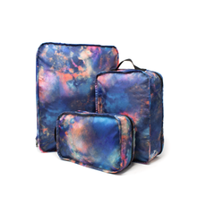 Load image into Gallery viewer, The large, medium, and small mineral burst travel organizers arranged on a white background.
