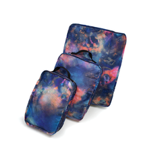 Load image into Gallery viewer, The large, medium, and small mineral burst travel organizers, arranged on a white background.
