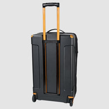 Load image into Gallery viewer, Back panel view of the suitcase with the telescopic handle extended. 
