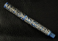 Load image into Gallery viewer, Front view of the fountain pen on a black textured surface.
