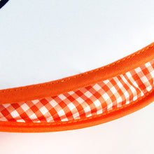 Load image into Gallery viewer, Interior close up to the UTEP tortilla warmer with orange checkered lining. 
