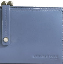 Load image into Gallery viewer, Close up to the blue wallet with Kenneth Cole logo embossed on the bottom right corner. 
