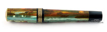 Load image into Gallery viewer, Side view of the fountain pen with the cap on.
