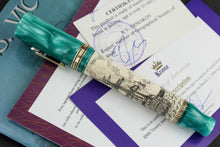 Load image into Gallery viewer, Side view of the fountain pen on top of the certificates.
