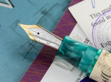 Load image into Gallery viewer, Close up to the pen nib with engraved decorations, Krone logo, 18K gold hallmark and the letter M.
