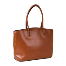 Load image into Gallery viewer, Angled front view of the tan leather tote bag. 

