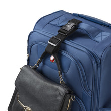Load image into Gallery viewer, The luggage strap attaching a purse to the grab handle on a suitcase.
