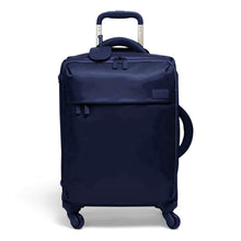 Load image into Gallery viewer, Front panel view of the navy blue suitcase with the telescopic handle extended. 
