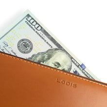 Load image into Gallery viewer, Close up to the wallet with a bill peeking from the main compartment. 
