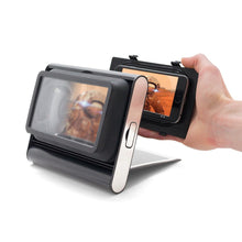 Load image into Gallery viewer, A hand holding a phone against the magnifier. 
