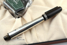 Load image into Gallery viewer, Side view of the fountain pen with the cap on.
