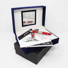 Load image into Gallery viewer, The red rollerball pen arranged with the presentation box, outer box, booklets and tag.
