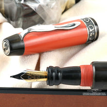 Load image into Gallery viewer, Close up to the fountain pen nib, grip section, and cap.
