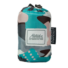 Load image into Gallery viewer, The pop backpack folded into its packable pocket.
