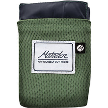 Load image into Gallery viewer, The green blanket folded into it's pocket.
