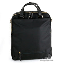 Load image into Gallery viewer, Back panel view of the slim backpack with the shoulder straps tucked. 
