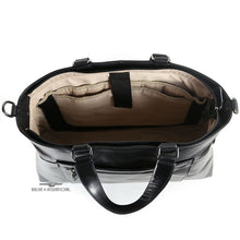 Load image into Gallery viewer, Top panel panel view of the black leather bag, featuring a tan lining and organization pockets. 
