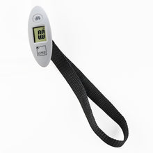 Load image into Gallery viewer, The digital scale with the black strap extended.
