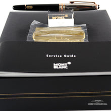 Load image into Gallery viewer, The fountain pen on top of the presentation box with the service guide. 
