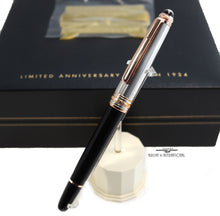 Load image into Gallery viewer, Angled view of the fountain pen on a pen stand. The presentation box is set behind it.
