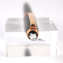 Load image into Gallery viewer, Top close up to the pen cap. it has a Mother of Pearl Montblanc logo. 

