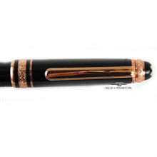 Load image into Gallery viewer, Close up to the pen's clip. It has a small diamond on the cap ring at the top.
