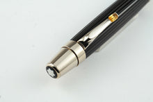 Load image into Gallery viewer, Angled close up to the top of the pen. It features a Montblanc logo.
