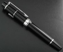 Load image into Gallery viewer, Side view of the fountain pen with the cap on.
