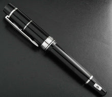 Load image into Gallery viewer, Side view of the fountain pen with the cap on.
