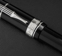 Load image into Gallery viewer, Close up to the engraved Arturo Toscanini signature on the cap ring. 
