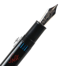 Load image into Gallery viewer, Close up to the pen's grip section and nib.
