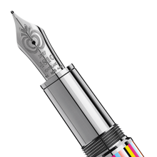 Load image into Gallery viewer, Close up to the fountain pen nib with an engraved apple and text, 2017, 4810 logo, Montblanc, and gold hallmarks. 
