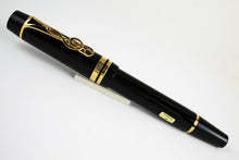 Load image into Gallery viewer, Side view of the fountain pen with the cap on. 
