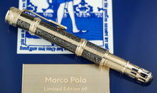 Load image into Gallery viewer, Side view of the fountain pen with the cap on. Set on top of the presentation box.
