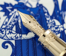 Load image into Gallery viewer, Close up to the fountain pen's nib with engraved decorations.
