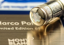 Load image into Gallery viewer, Close up to the top of the cap, featuring a Mother of Pearl Montblanc logo.
